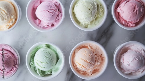 Assorted homemade ice cream in pastel colors, shot from above, clear window letting in natural daylight