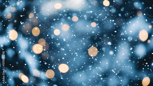 Soft snowflakes gently falling from the sky against a blurred cool-toned background of deep blue and grey.