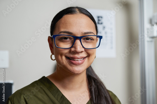 Professional Optometrist Smiling Confidently in Eyeglasses at Modern Eye Clinic Setting