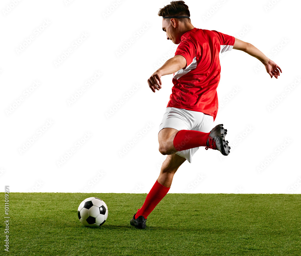 Focused sportsman, dressed in red and white, performing dynamic strike on ball during football training against transparent backdrop. Concept of championship, sport events, final game. Ad Focused sportsman, dressed in red and white, performing dynamic strike on ball during football training against transparent backdrop. Concept of championship, sport events, final game. Ad