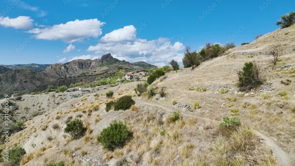 Mountains and Olive groves around Ghost Town from a drone, Pentedattilo Village, Calabria, Italy, Europe Mountains and Olive groves around Ghost Town from a drone, Pentedattilo Village, Calabria, Italy, Europe