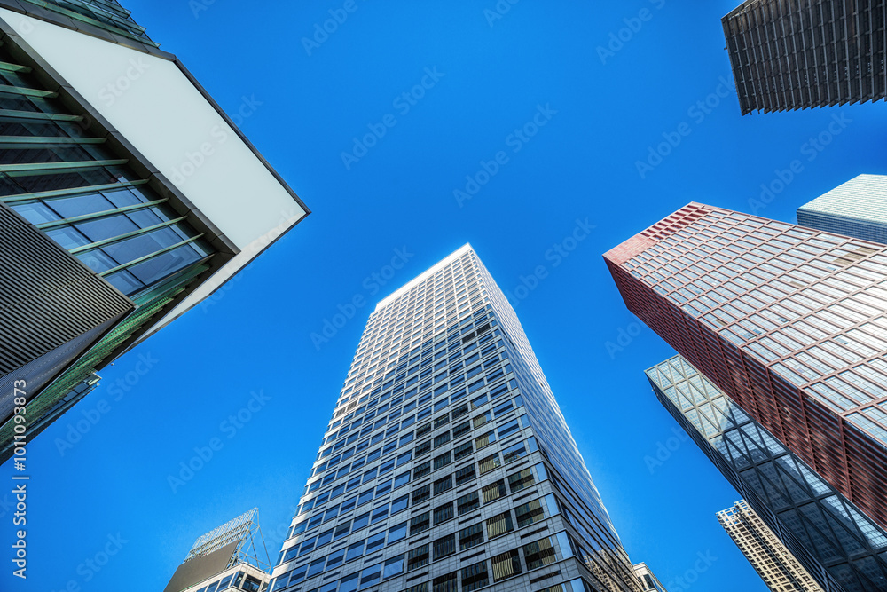 Urban Skyscrapers Stretching into Clear Blue Sky