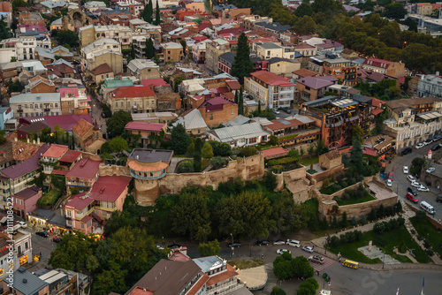 Aerial view of Tbilisis historic district with colorful rooftops and ancient fortifications photo