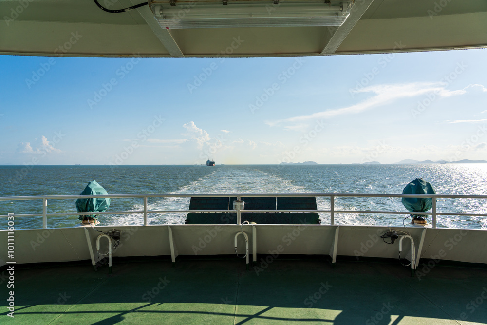 Fototapeta premium Scenic Maritime Voyage: Embracing the Open Water from the Ship's Deck