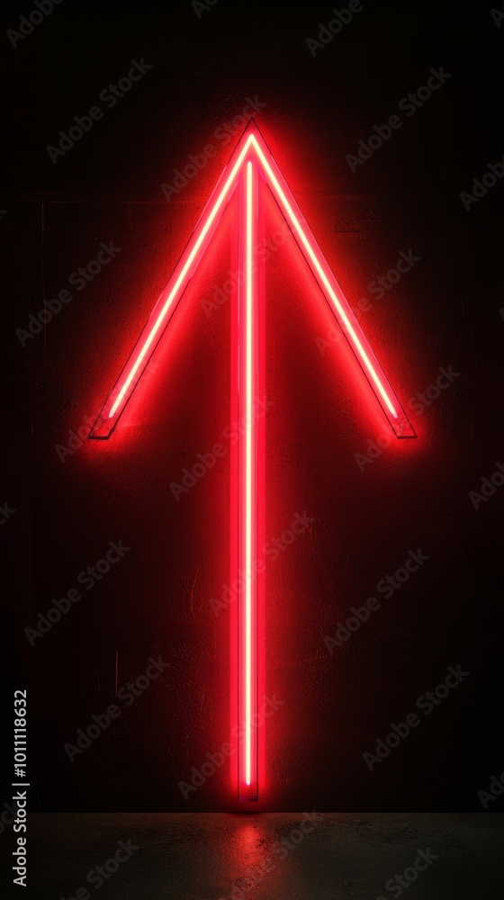 Red neon arrow pointing up on black background Red neon arrow pointing up on black background