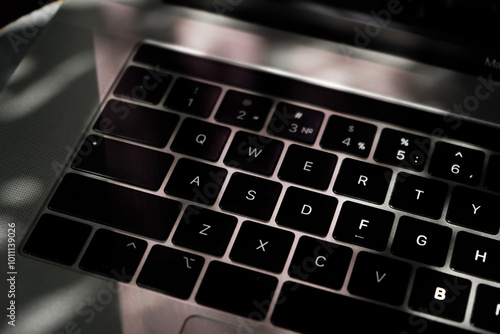 Someone works on a laptop outdoors, hands closeup. Developing a project, investment and business, typing on the keyboard.