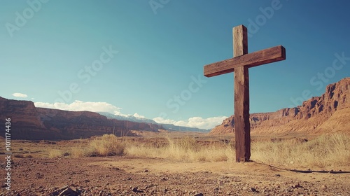 A wooden cross stands tall in a vast desert landscape, symbolizing faith and resilience amidst breathtaking natural scenery. photo