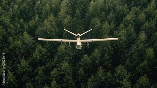 Aerial view of a drone flying over a dense forest, showcasing technology and nature interaction in a vibrant green landscape.