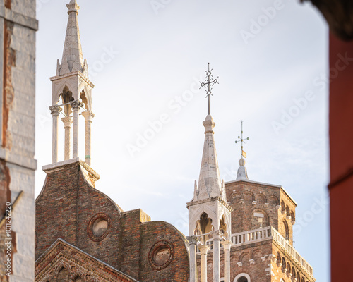 Architectural details of Basilica di Santa Maria Gloriosa dei Frari in Venice, Italy. Frari church (Santa Maria Gloriosa dei Frari) in San Polo district of Venice.  photo