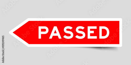 Red color arrow shape sticker label with word passed on gray background