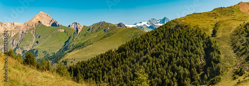 High resolution stitched alpine summer panorama with the legendary Mount Großglockner in the background at Mount Goldried, Matrei, Eastern Tyrol, Austria