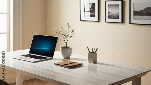 Wallpaper Mural A minimalist home office setup featuring a laptop, a potted plant, and organized stationery on a clean white desk. Torontodigital.ca