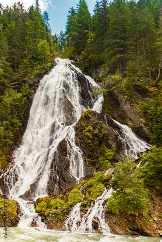 Alpine summer view at Haslacher Schleierwasserfall waterfall, Kals am Großglockner, Lienz, Eastern Tyrol, Austria photo