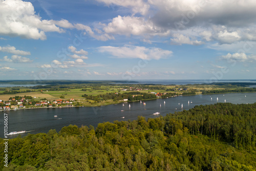 Wallpaper Mural Aerial view of Mikolajskie Lake surrounded by lush greenery and small boats sailing under a bright sky Torontodigital.ca