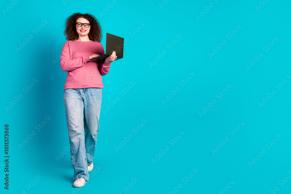Full body portrait of nice young girl walk empty space laptop isolated on turquoise color background
