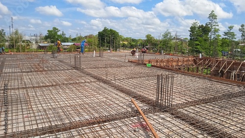 Iron fittings on wooden formwork for house floor with concrete slab