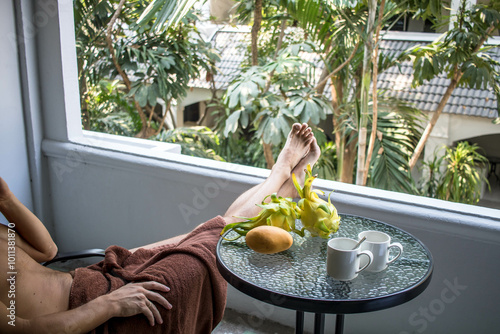 person relaxing on the balcony