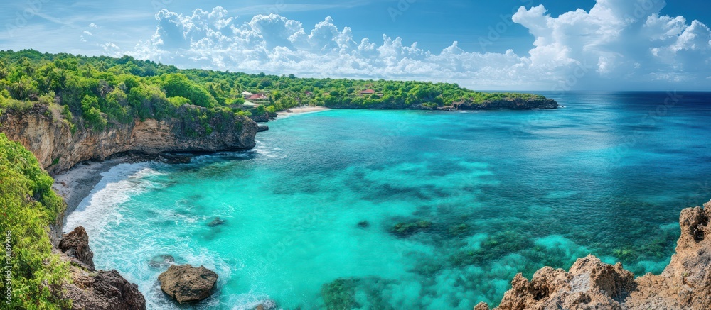 Obraz premium A panoramic view of a tropical beach with clear turquoise water and lush green cliffs.