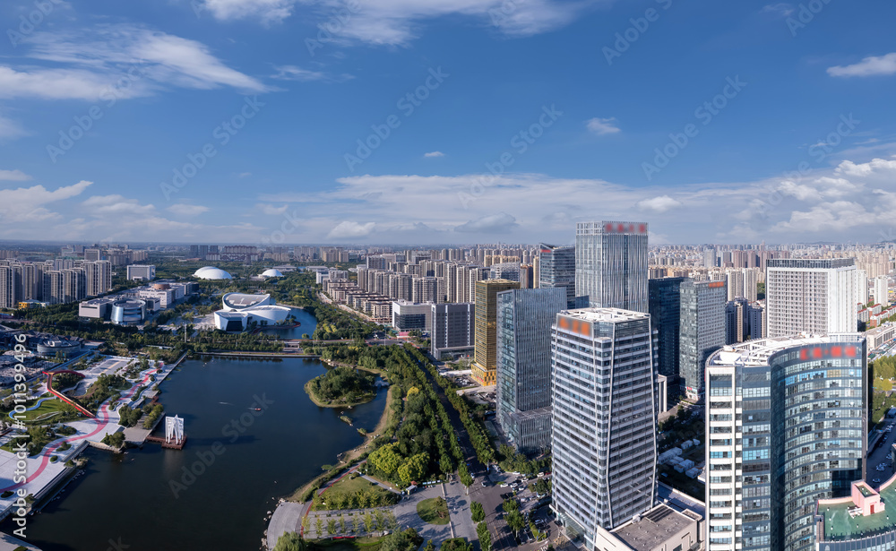 Fototapeta premium Spectacular Aerial View of a Vibrant Urban Cityscape with Water and Greenery