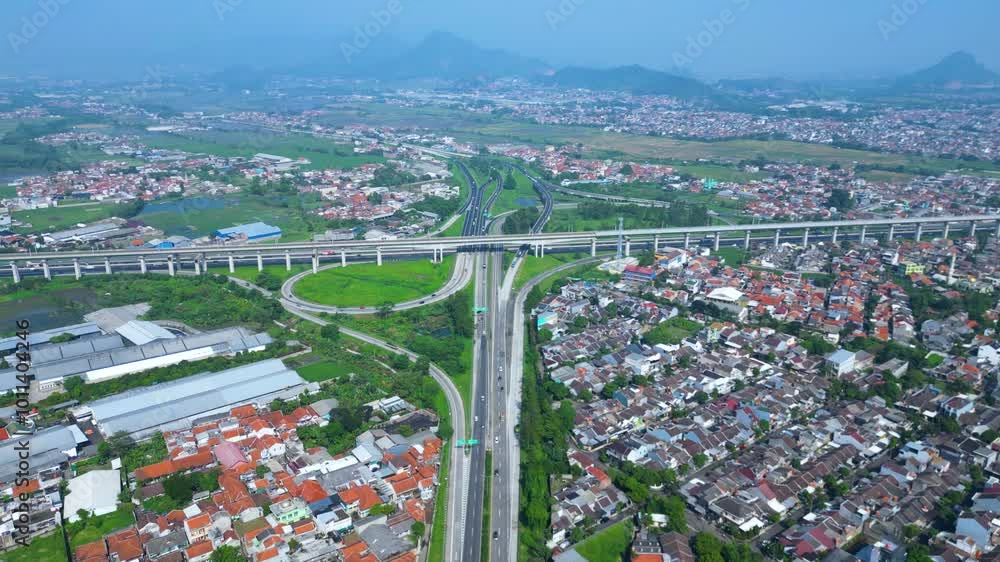 Title	
Established Aerial View of Pasir Koja Interchange, the meeting point of Soroja Toll Road, Purbaleunyi Toll Road and Jakarta-Bandung High Speed ​​Rail Line, Bandung, Indonesia