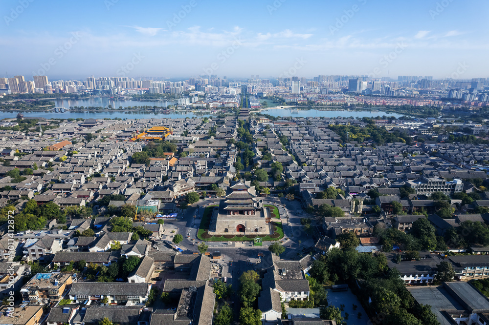 Fototapeta premium Aerial View of Historic City with Modern Skyline and Traditional Architecture