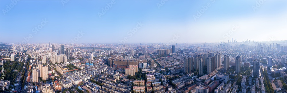 Expansive Urban Cityscape with Clear Blue Skies and Skyscrapers Expansive Urban Cityscape with Clear Blue Skies and Skyscrapers