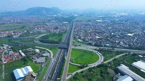 Established Aerial View of Pasir Koja Interchange, the meeting point of Soroja Toll Road, Purbaleunyi Toll Road and Jakarta-Bandung High Speed ​​Rail Line, Bandung, Indonesia photo