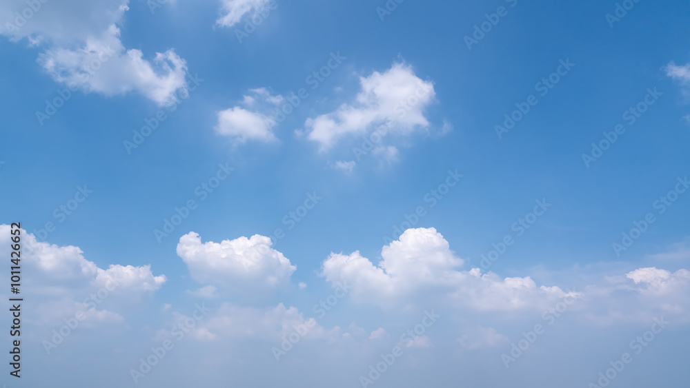A Tranquil Sky Filled with Soft White Clouds and Clear Blue Atmosphere A Tranquil Sky Filled with Soft White Clouds and Clear Blue Atmosphere