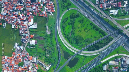 Established Aerial View of Pasir Koja Interchange, the meeting point of Soroja Toll Road, Purbaleunyi Toll Road and Jakarta-Bandung High Speed ​​Rail Line, Bandung, Indonesia photo