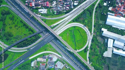 Established Aerial View of Pasir Koja Interchange, the meeting point of Soroja Toll Road, Purbaleunyi Toll Road and Jakarta-Bandung High Speed ​​Rail Line, Bandung, Indonesia photo