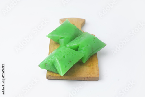 A typical Indonesian snack often called Kue Jentik Manis is on a wooden coaster photo