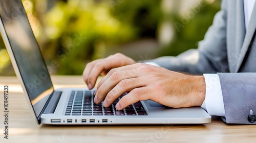 Businessman Typing on Laptop in Nature Setting