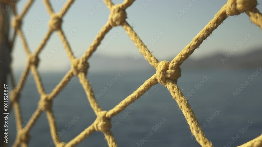 Rope net close up while yacht is moving, sea view, blurred frame Rope net close up while yacht is moving, sea view, blurred frame