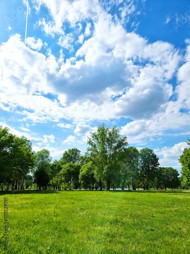 A large green par area on a sunny day at Bundek city park, Zagreb, Croatia photo