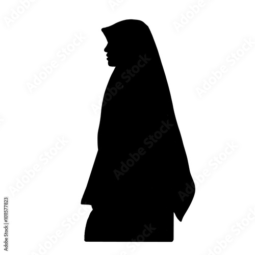 silhouette of a woman wearing a hijab who is staring