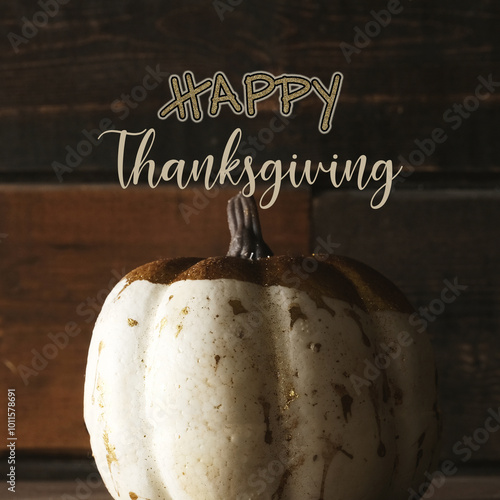 Happy thanksgiving greeting background with decorative white pumpkin against rustic wood background