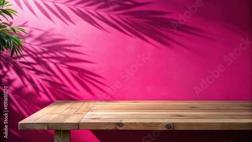 Forced perspective empty table on bright pink wall