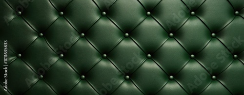 A textured green leather surface with tufted design and metal studs, showcasing a classic, elegant aesthetic. photo