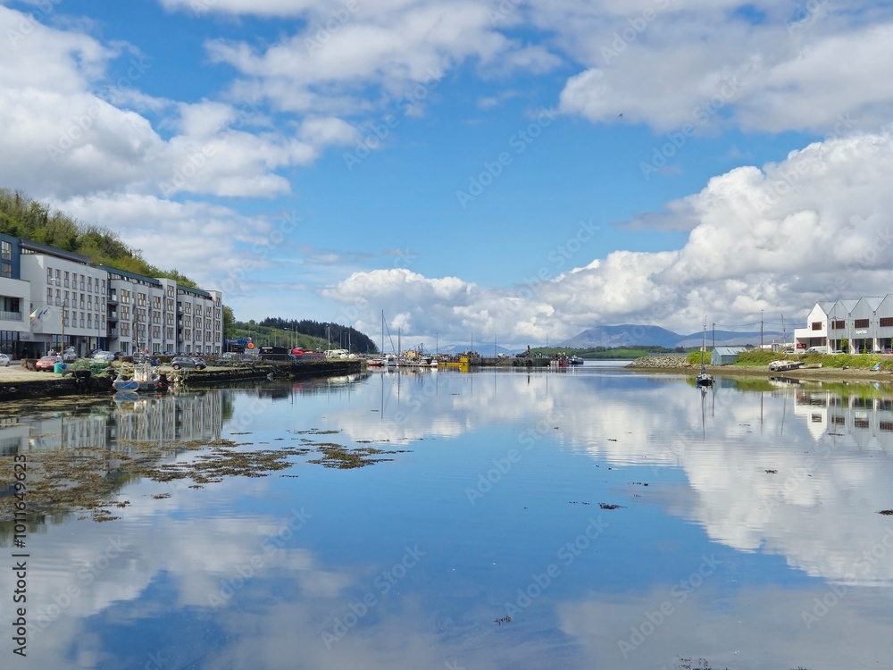 Serene River Waterscape With Cloud Reflections And Gentle Waves Serene River Waterscape With Cloud Reflections And Gentle Waves