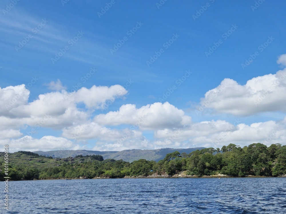 Tranquil Waterscape With Reflections Under A Cloudy Sky Tranquil Waterscape With Reflections Under A Cloudy Sky