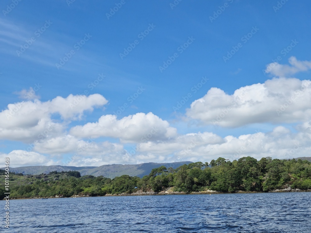 Serene Waterscape: Tranquil River With Cloud Reflections And Gentle Ripples Serene Waterscape: Tranquil River With Cloud Reflections And Gentle Ripples