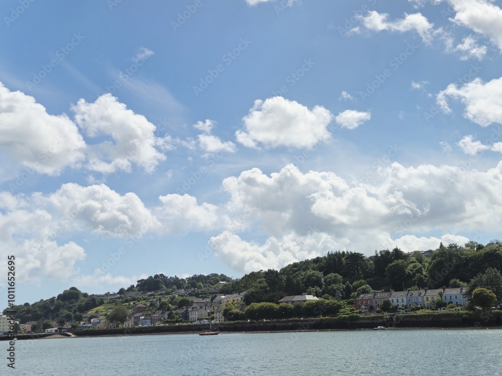 Serene Waterscape: Reflective River With Gentle Waves And Cloudy Skies Serene Waterscape: Reflective River With Gentle Waves And Cloudy Skies