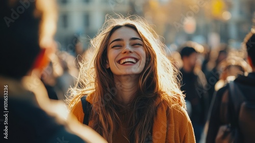 woman standing alone in a crowd looking at camera, her face reflecting deep emotions of happiness, she is laughing