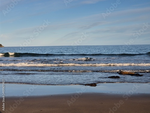 Summer Sunset Over Blue Ocean Waves At The Beach