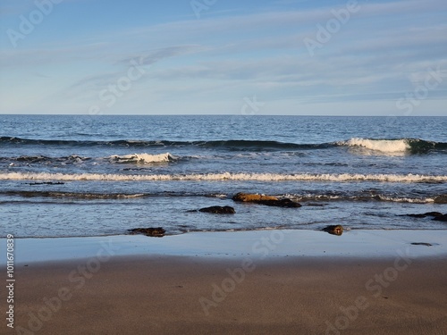 Summer Day At The Blue Ocean Shore: Waves And Golden Sand