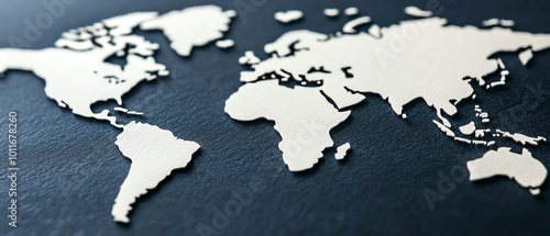 Stylish die-cut map of the world on dark background, highlighting continents and oceans.