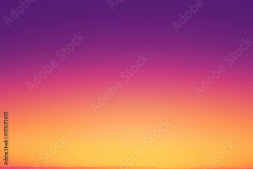 Abstract vibrant sunset sky with gradient hues of orange, yellow, and purple. Perfect for design backgrounds and creative projects.