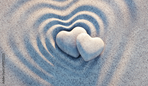 Photography Two heart shaped pebbles on circle sand waves with evening sun - 3d illustration