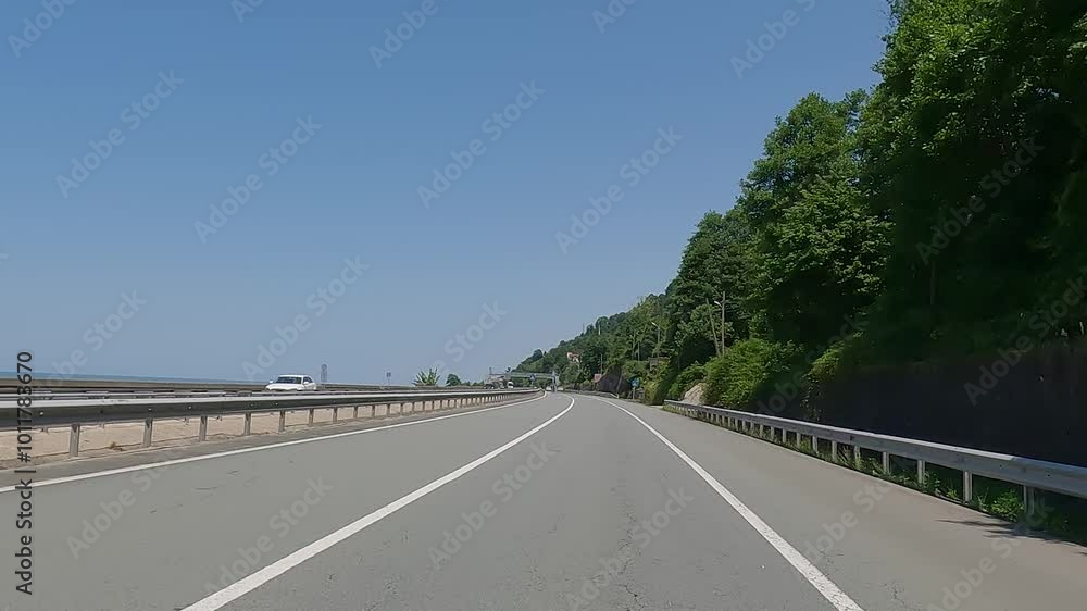 highway road in the countryside, roadside and asphalt, green forest and blue sky highway road in the countryside, roadside and asphalt, green forest and blue sky