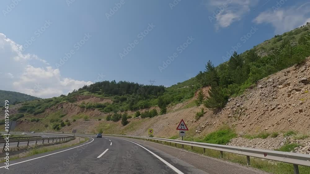 highway road in the countryside, roadside and asphalt, mountains, green forest and blue sky highway road in the countryside, roadside and asphalt, mountains, green forest and blue sky